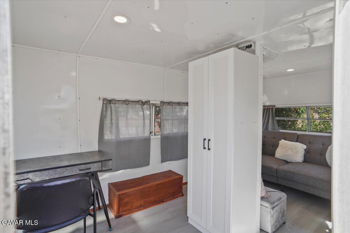 42652 55th Street West Lancaster, CA 93536 - Photo 24 of 28 a room with a couch and a walk in closet