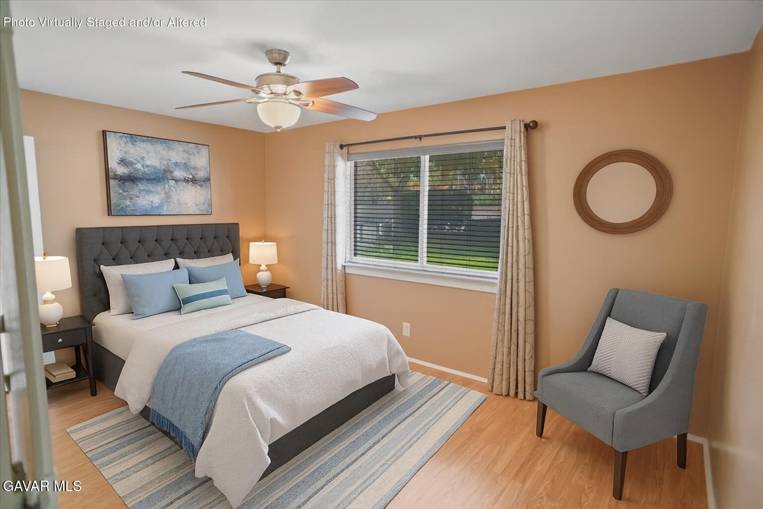 42652 55th Street West Lancaster, CA 93536 - Photo 4 of 28 a bedroom with a bed and window