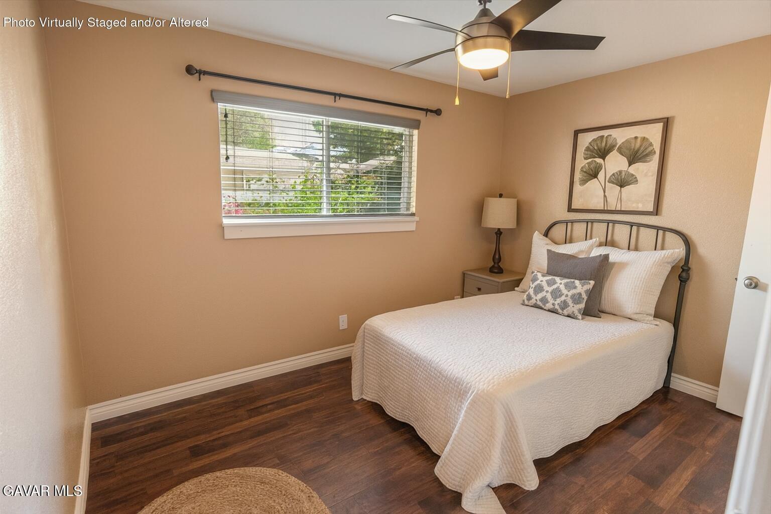 42652 55th Street West Lancaster, CA 93536 - Photo 5 of 28 a bedroom with a bed and window