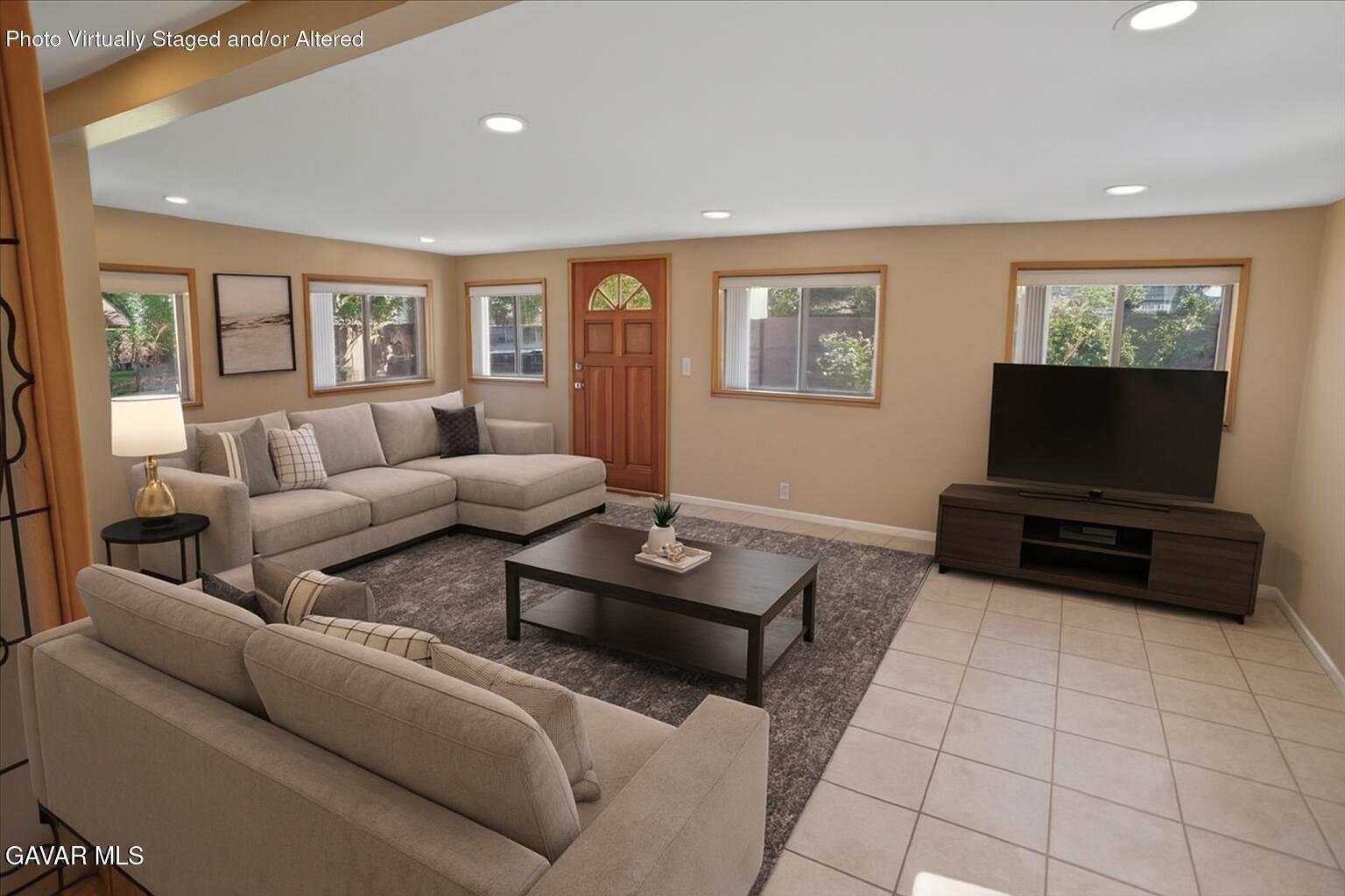 42652 55th Street West Lancaster, CA 93536 - Photo 6 of 28 a living room with furniture and a flat screen tv