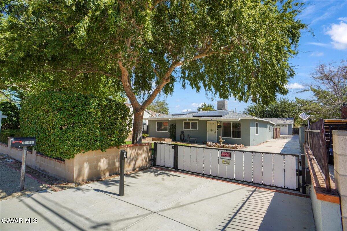 42652 55th Street West Lancaster, CA 93536 - Photo 7 of 28 a view of a terrace with chairs and potted plants