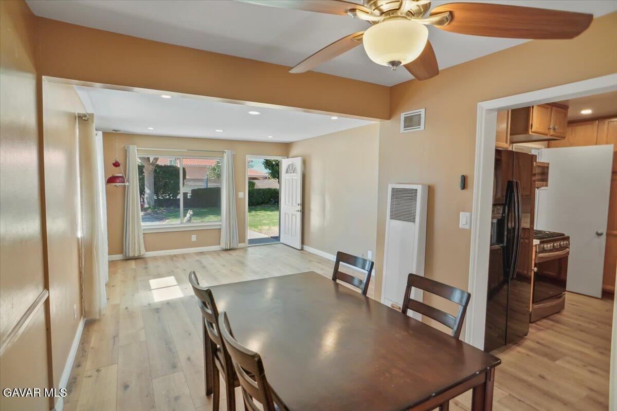 42652 55th Street West Lancaster, CA 93536 - Photo 10 of 28 a view of a dining room with furniture window and wooden floor
