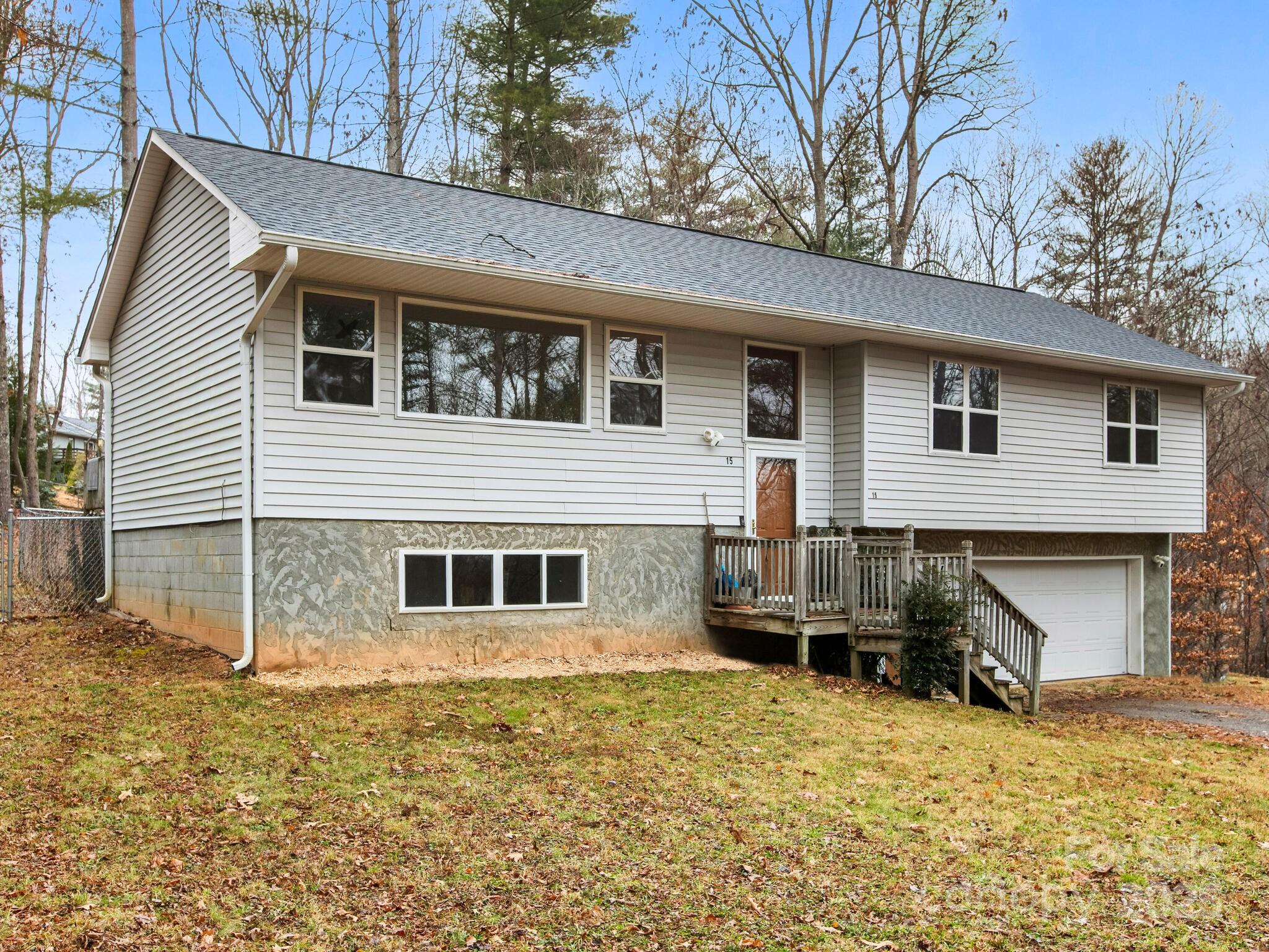 15 Gunflint Trail Fletcher, NC 28732 - Photo 1 of 25 a view of a house with a backyard