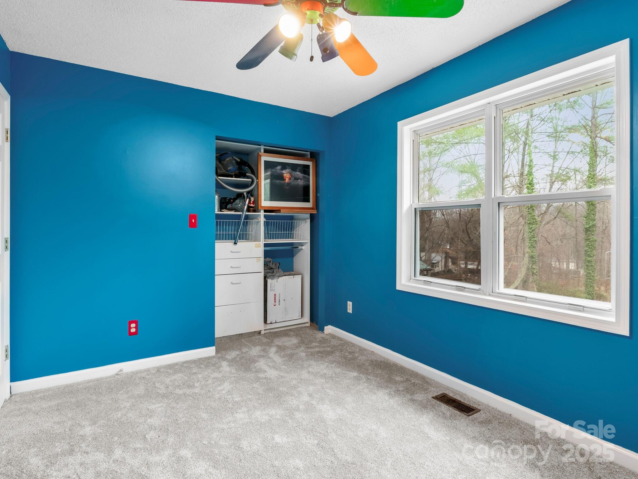 15 Gunflint Trail Fletcher, NC 28732 - Photo 12 of 25 an empty room with windows and ceiling fan