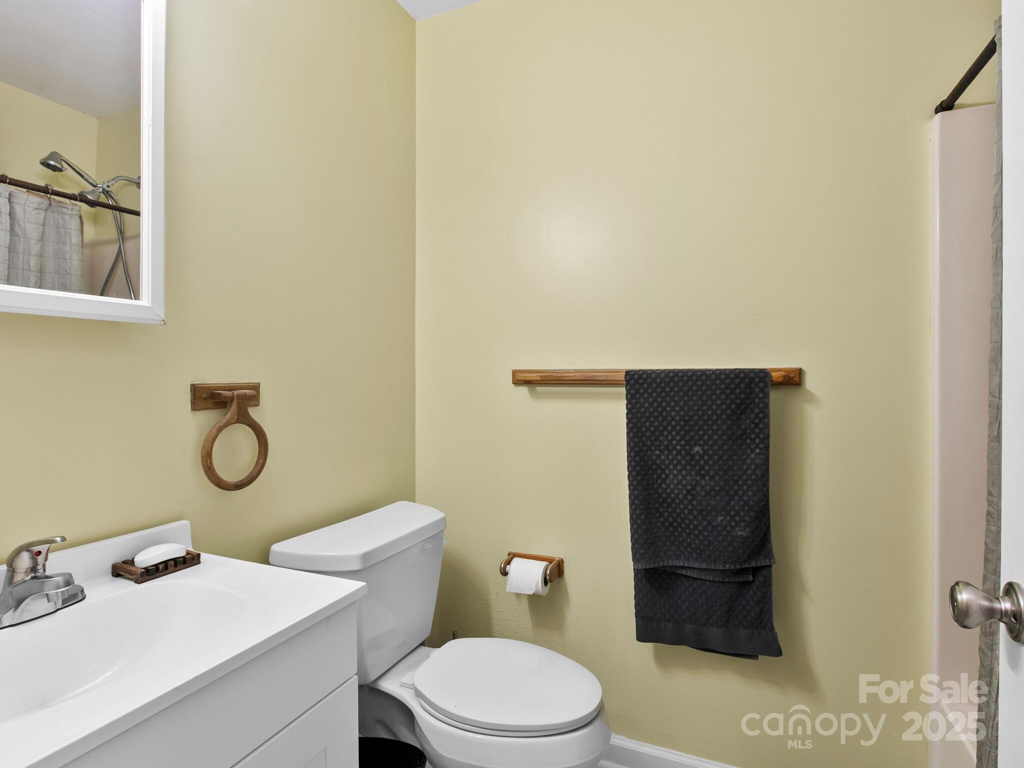 15 Gunflint Trail Fletcher, NC 28732 - Photo 14 of 25 a bathroom with a granite countertop toilet and sink