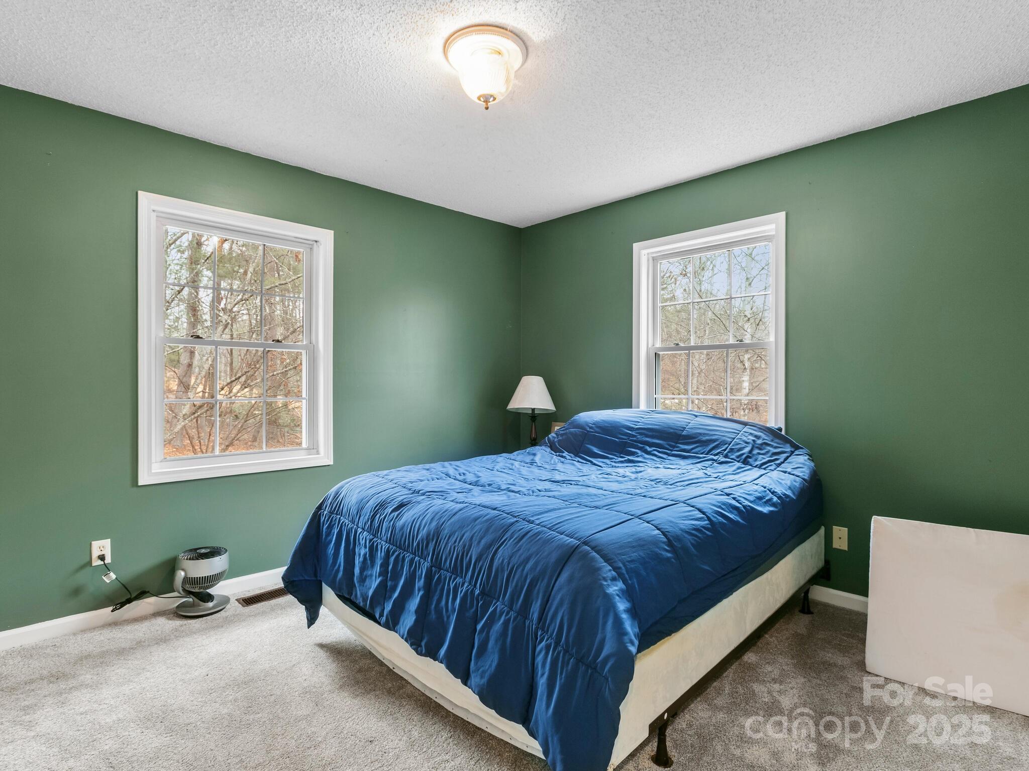15 Gunflint Trail Fletcher, NC 28732 - Photo 15 of 25 a bedroom with a bed and a window