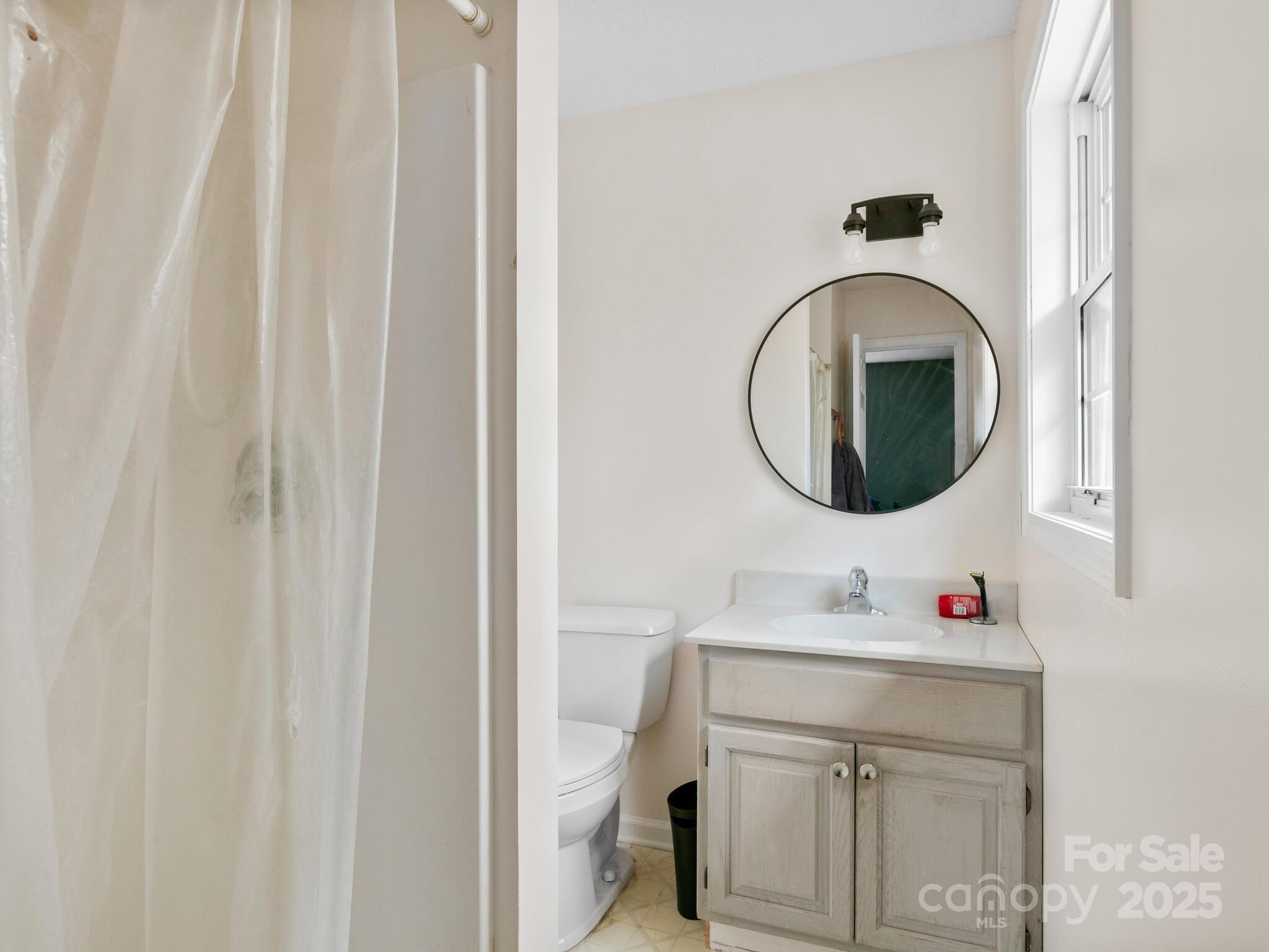 15 Gunflint Trail Fletcher, NC 28732 - Photo 17 of 25 a bathroom with a sink and a mirror