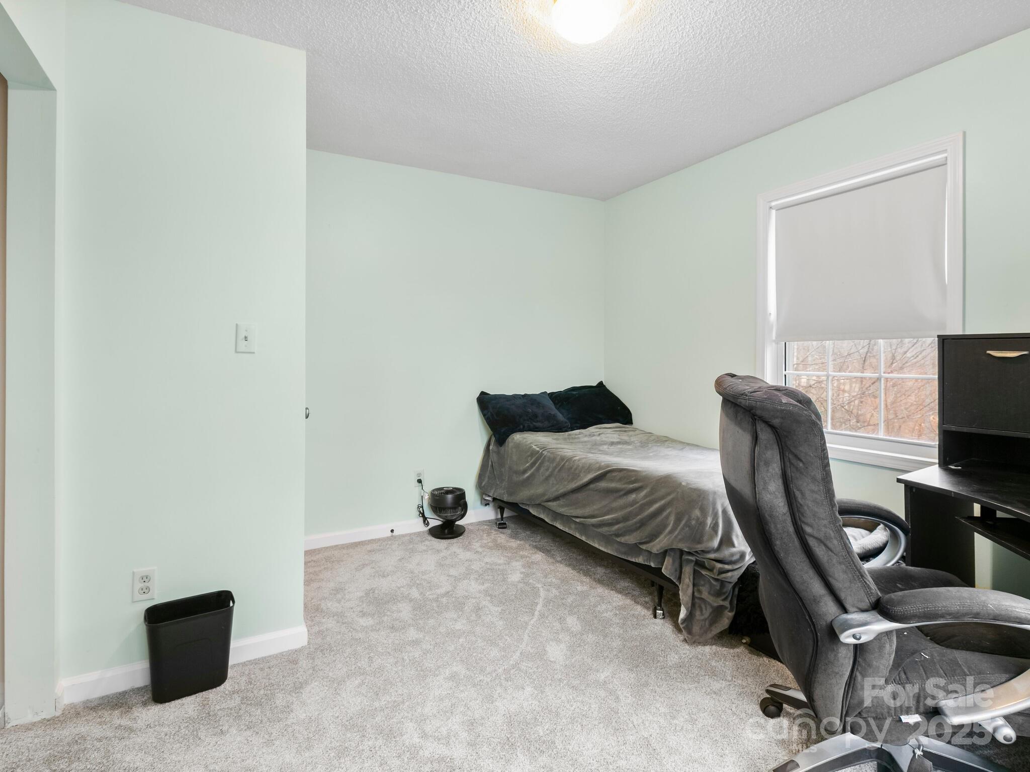 15 Gunflint Trail Fletcher, NC 28732 - Photo 19 of 25 a bedroom with a bed and a chair