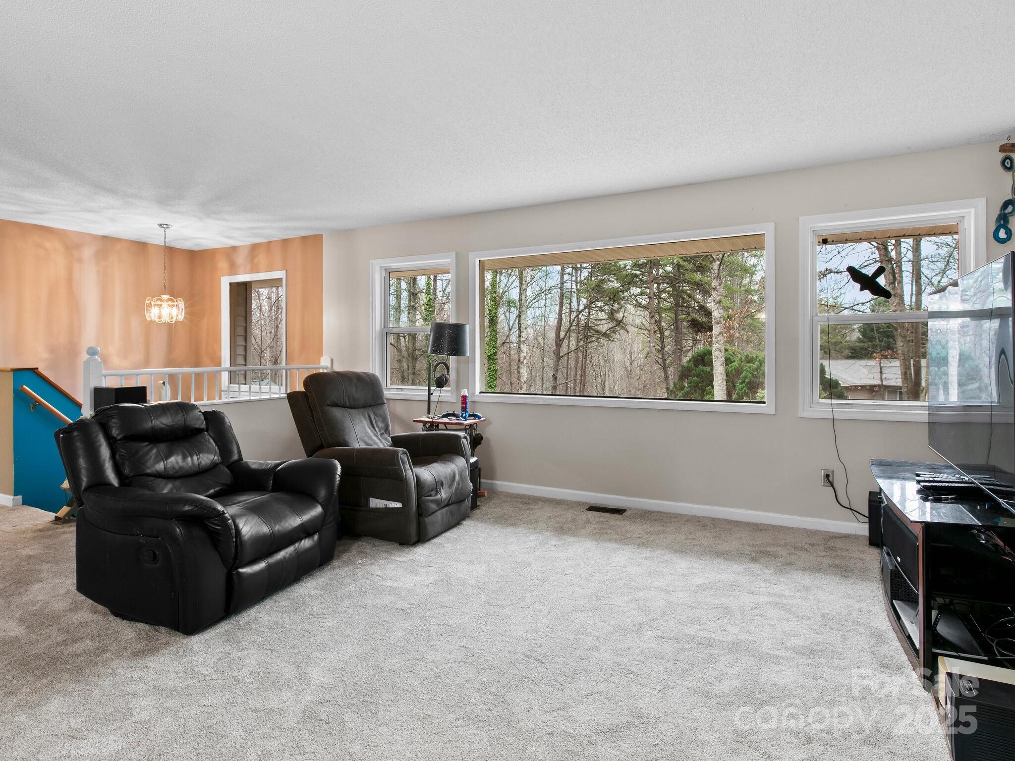 15 Gunflint Trail Fletcher, NC 28732 - Photo 4 of 25 a living room with furniture and a flat screen tv