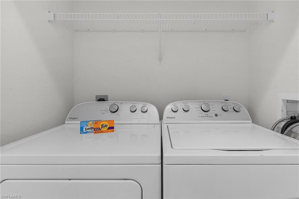 7870 Mahogany Run Lane, Unit 1724 Naples, FL 34113 - Photo 16 of 21 a utility room with dryer and washer