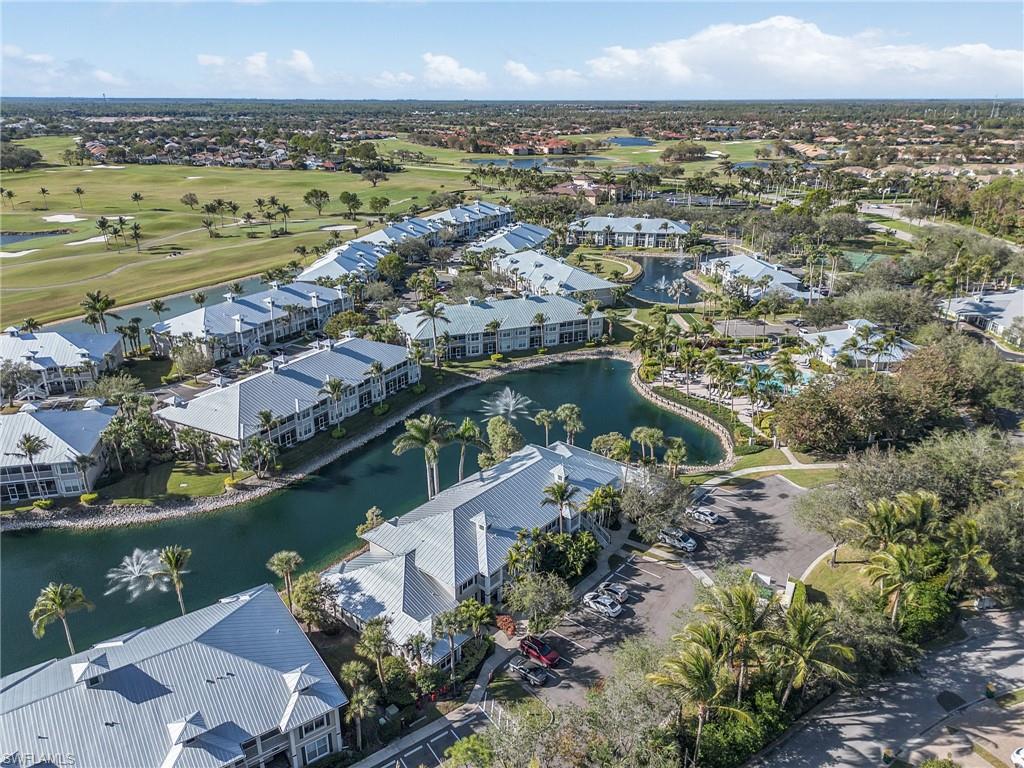 7870 Mahogany Run Lane, Unit 1724 Naples, FL 34113 - Photo 19 of 21 an aerial view of a city with a lake view