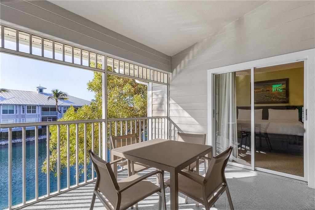 7870 Mahogany Run Lane, Unit 1724 Naples, FL 34113 - Photo 2 of 21 a view of a balcony with furniture