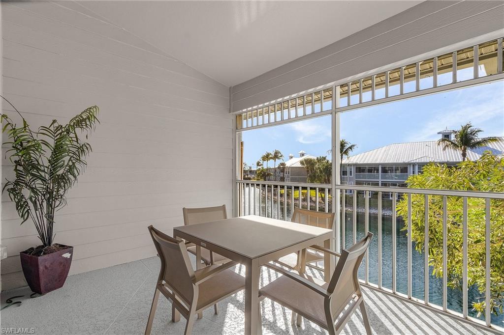 7870 Mahogany Run Lane, Unit 1724 Naples, FL 34113 - Photo 3 of 21 a view of a balcony dining area