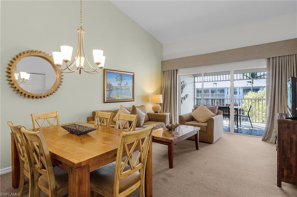 7870 Mahogany Run Lane, Unit 1724 Naples, FL 34113 - Photo 4 of 21 a living room with furniture a lamp and a large window