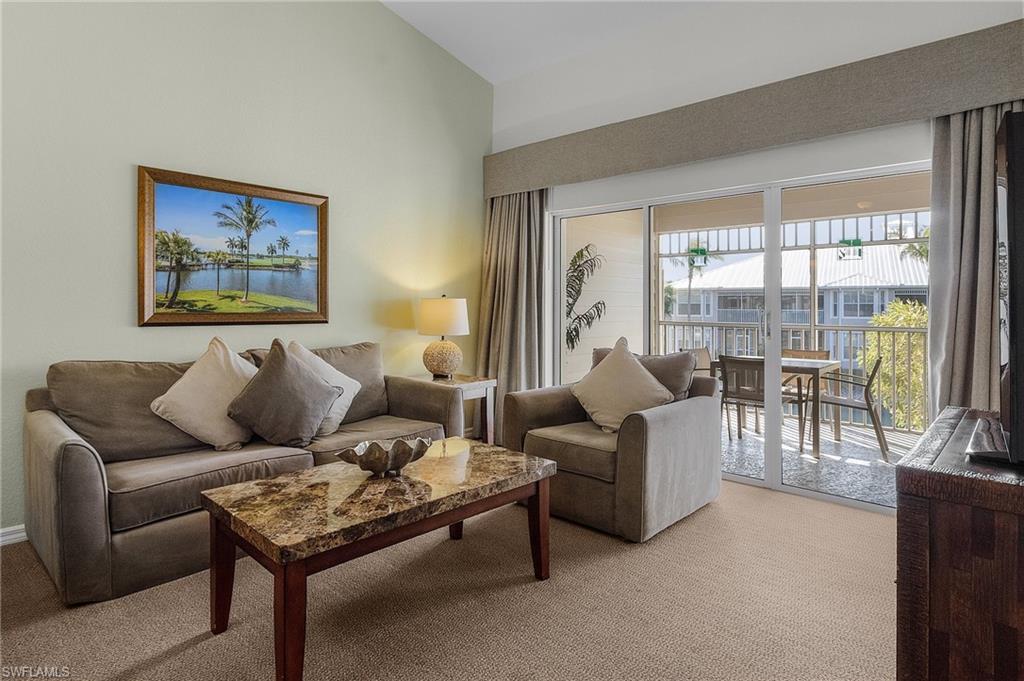 7870 Mahogany Run Lane, Unit 1724 Naples, FL 34113 - Photo 5 of 21 a living room with furniture and a large window