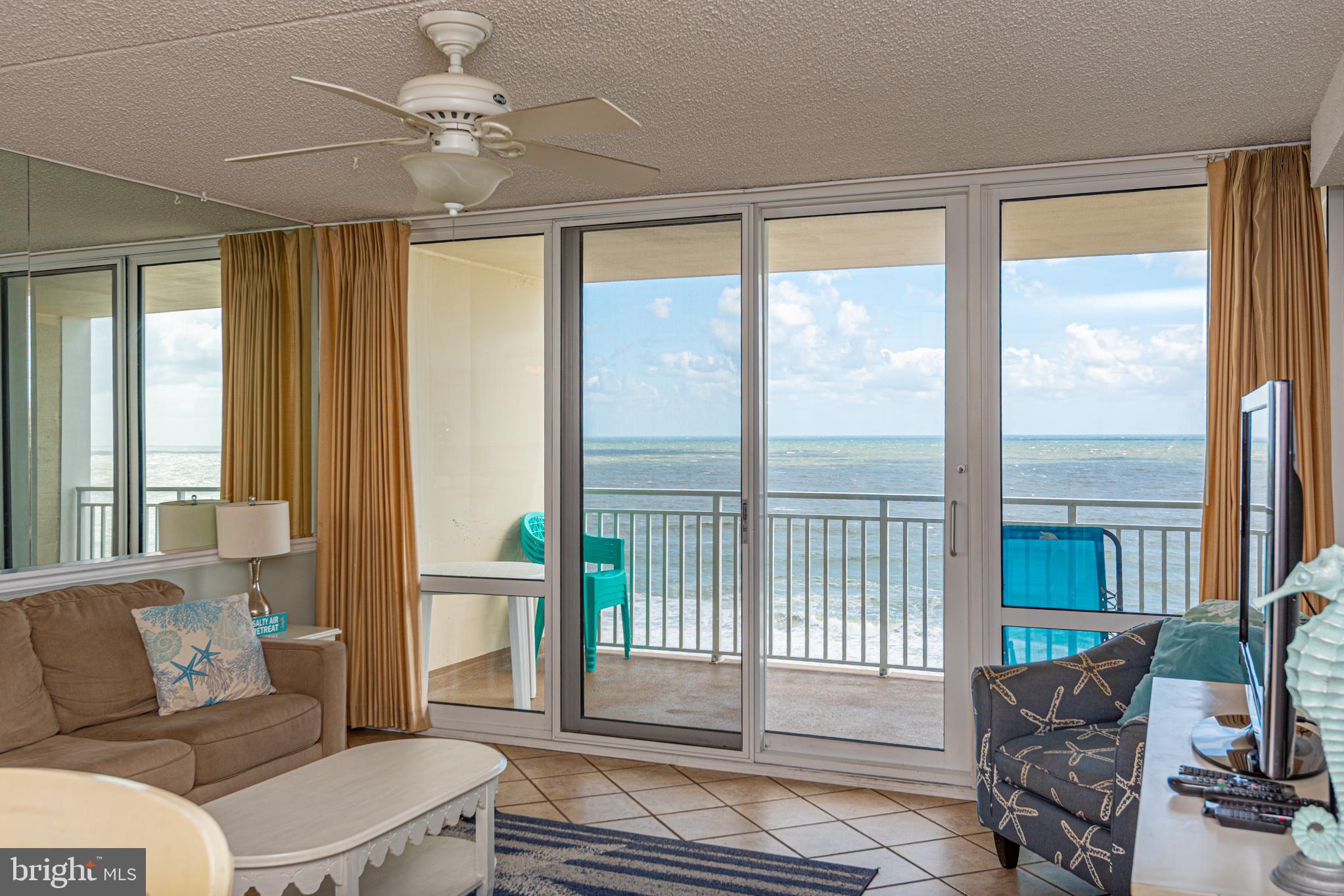 11700 Coastal Highway, Unit 1109 Ocean City, MD 21842 - Photo 1 of 50 a living room with furniture and a window