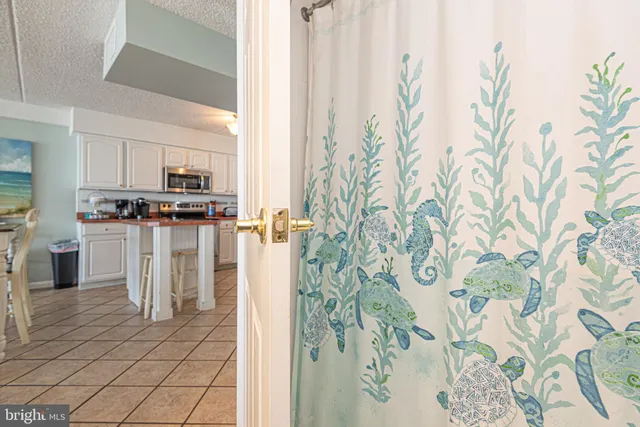 a kitchen with stainless steel appliances a sink and a stove