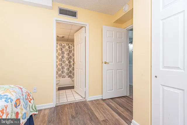 a view of front door with wooden floor