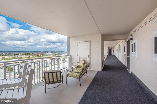 a view of a balcony with furniture