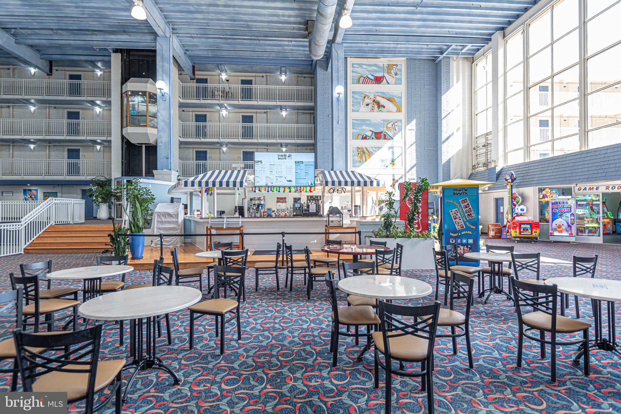 11700 Coastal Highway, Unit 1109 Ocean City, MD 21842 - Photo 35 of 50 a roof deck with table and chairs