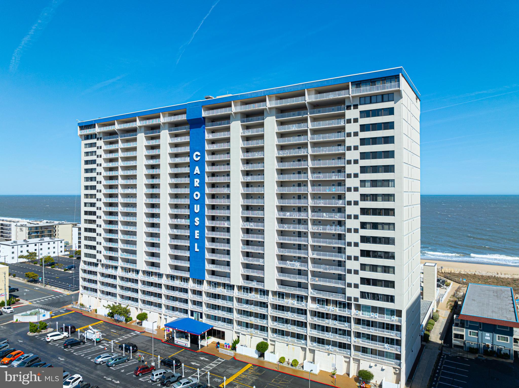 11700 Coastal Highway, Unit 1109 Ocean City, MD 21842 - Photo 45 of 50 a front view of a building with outdoor seating