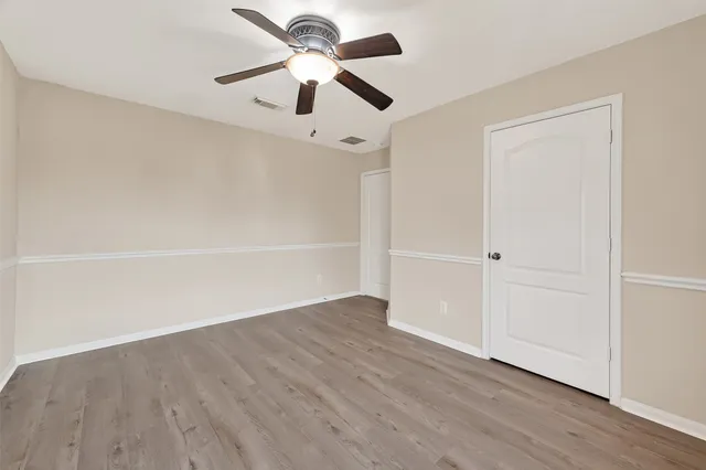 a bedroom with a bed and a large window with outer view