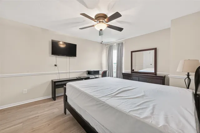 a bed room with a bed and chair