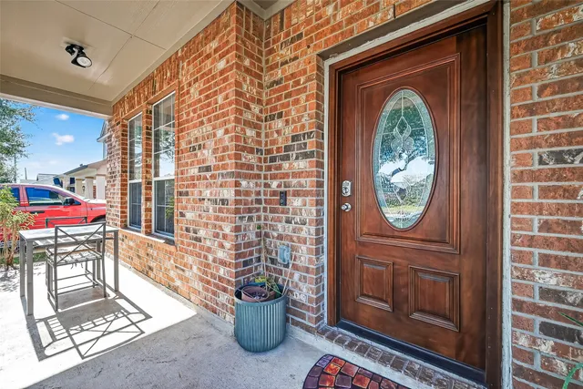 a front view of a house with outdoor seating