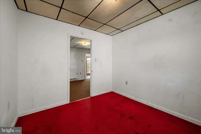 a view of a room with a hallway