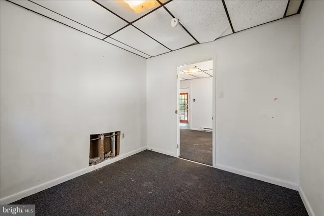 a view of house with backyard