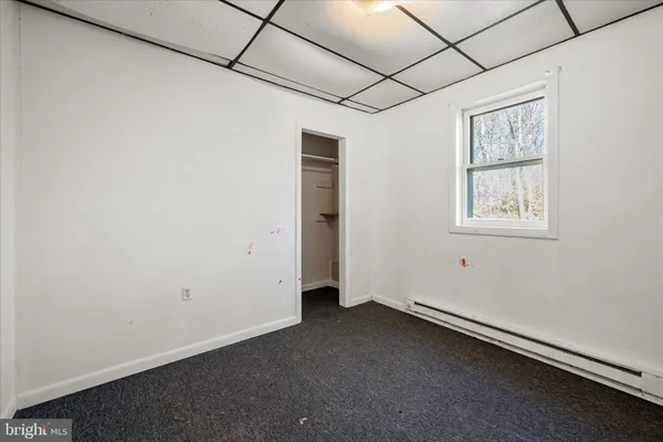 a view of house with backyard