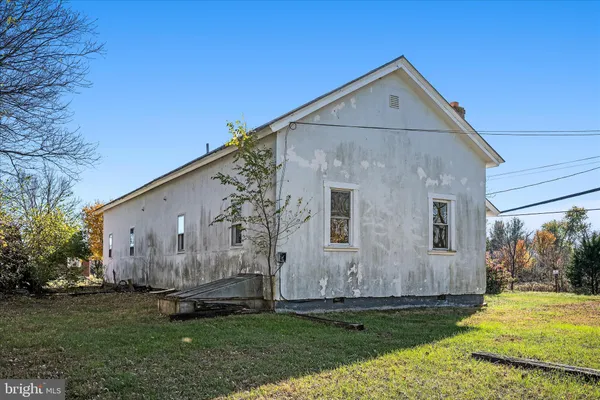 a view of a yard with a tree in the background