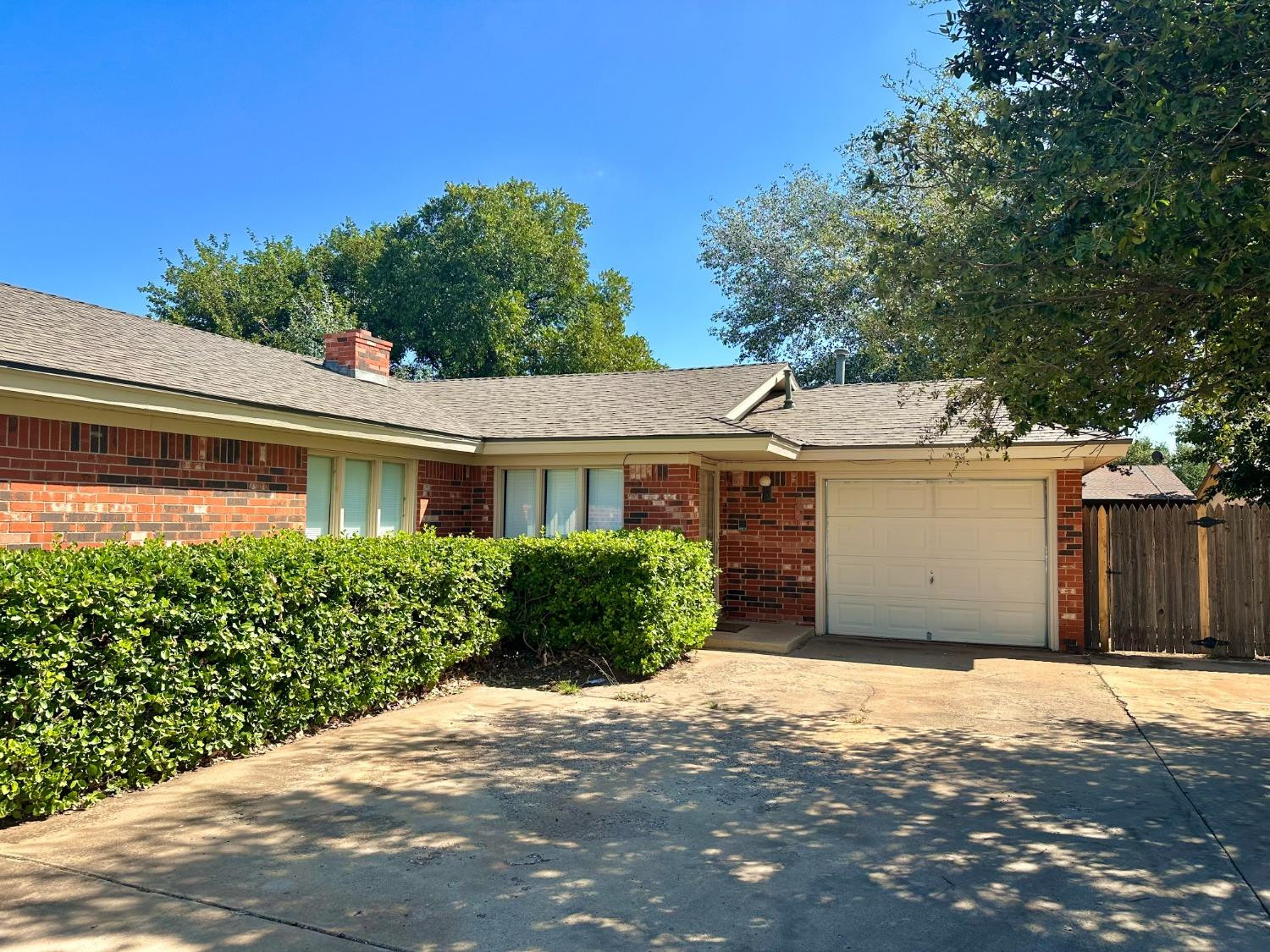 7805 Memphis Avenue, Unit B Lubbock, TX 79423 - Photo 1 of 13 a front view of a house with a yard