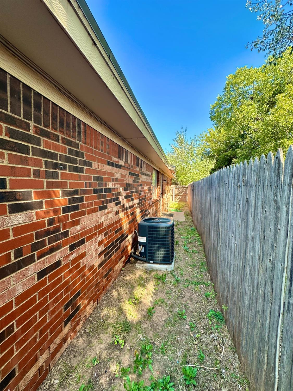 7805 Memphis Avenue, Unit B Lubbock, TX 79423 - Photo 12 of 13 a view of a pathway with a building in the background