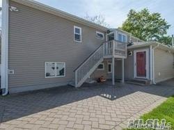 12 Ross Avenue Melville, NY 11747 - Photo 14 of 15 Rear view of property with stairway, a patio area, and a deck