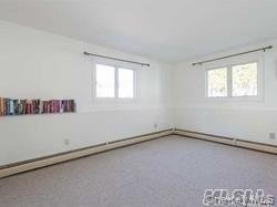 12 Ross Avenue Melville, NY 11747 - Photo 10 of 15 Carpeted spare room featuring plenty of natural light