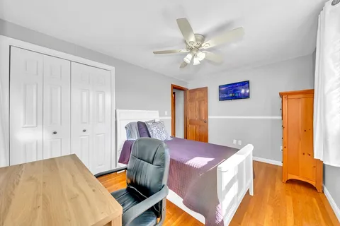 a bed room with a bed and a chandelier