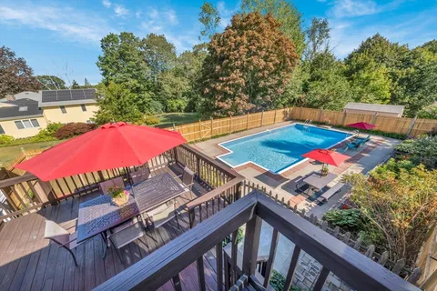 a view of a balcony with wooden floor