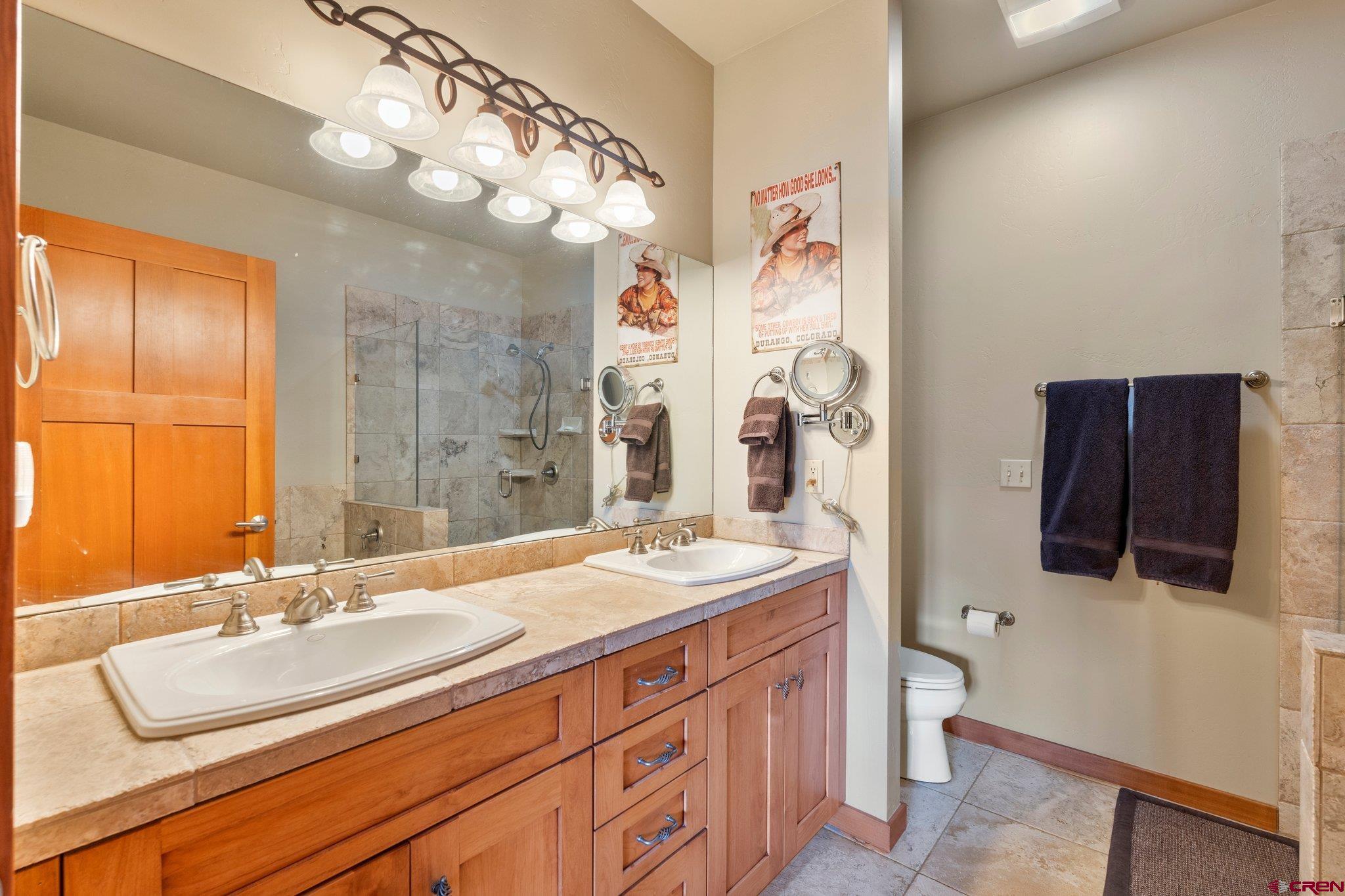 784 Animas View Drive Durango, CO 81301 - Photo 23 of 35 a bathroom with a sink double vanity and a mirror