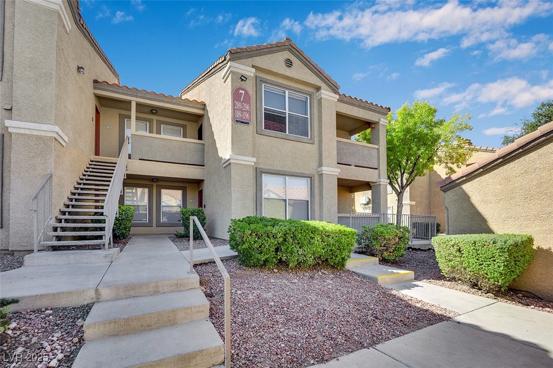 View of building exterior featuring stairway
