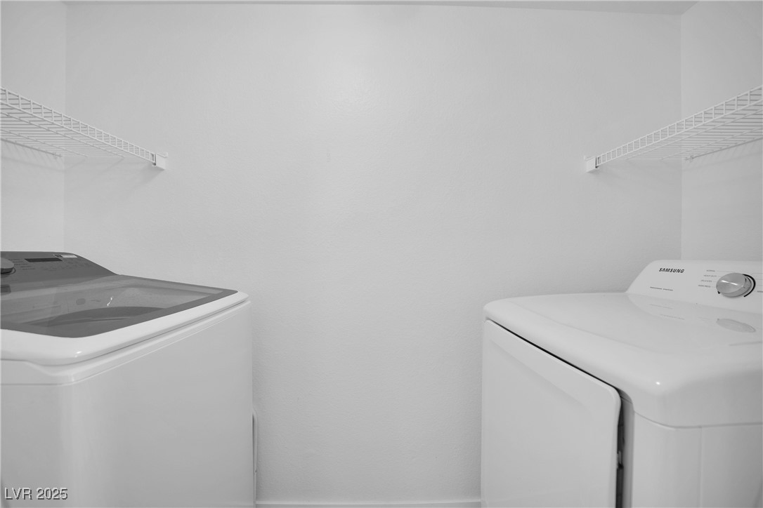 2300 East Silverado Ranch Boulevard, Unit 1189 Las Vegas, NV 89123 - Photo 26 of 27 Laundry area featuring washing machine and clothes dryer