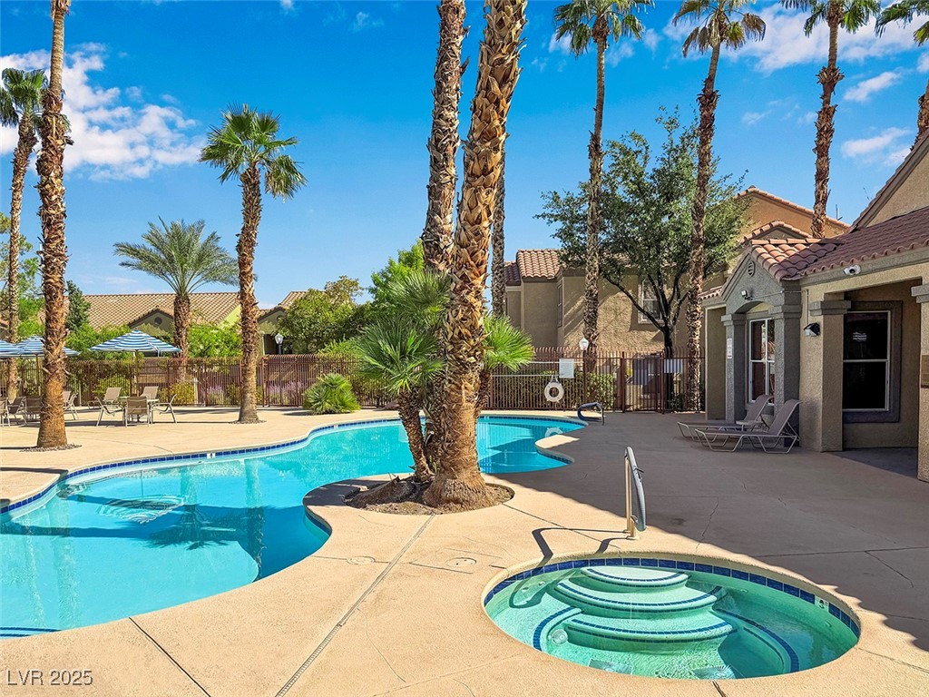2300 East Silverado Ranch Boulevard, Unit 1189 Las Vegas, NV 89123 - Photo 5 of 27 Community pool with a hot tub and a patio