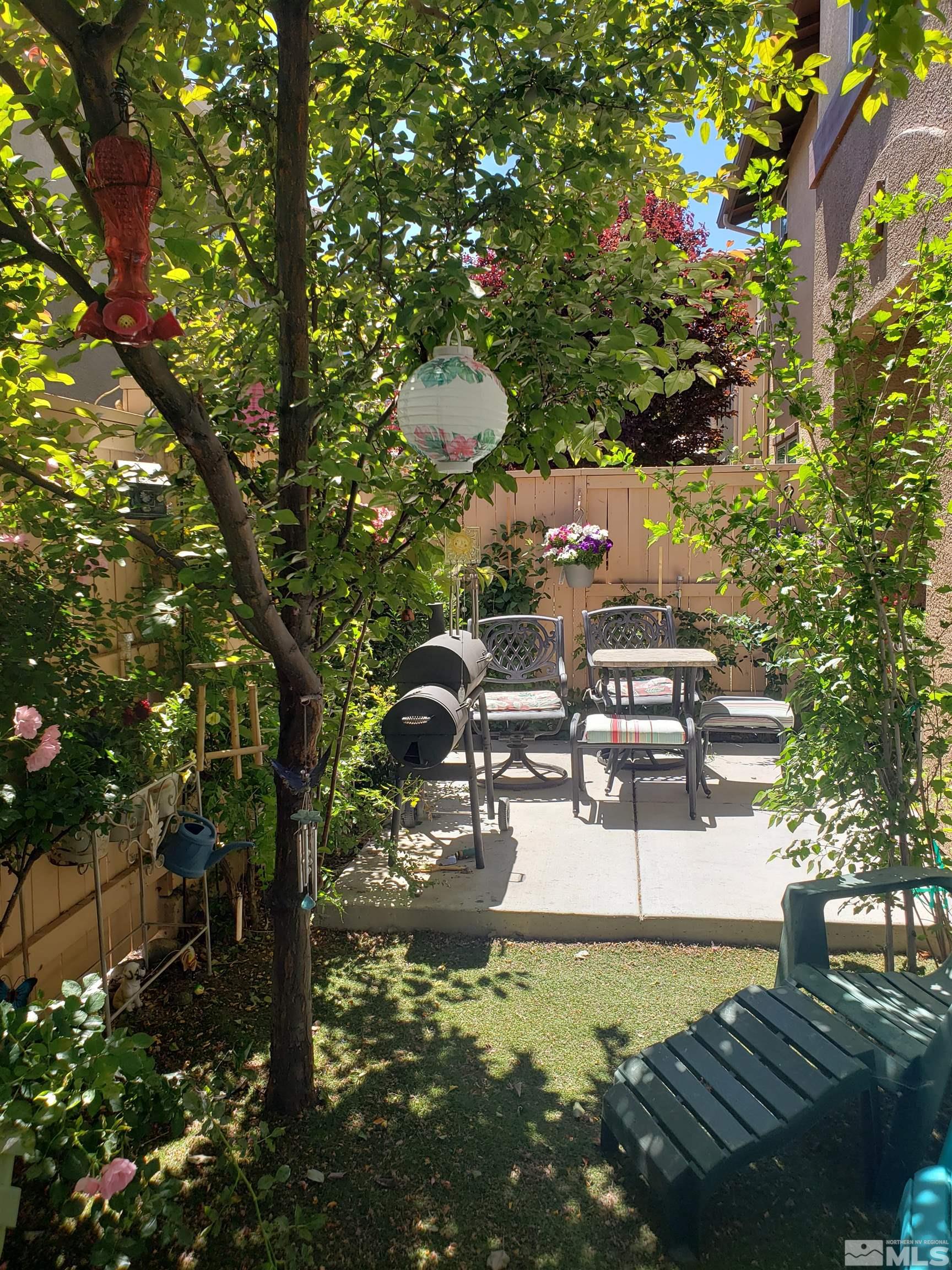 1896 Wind Ranch Road, Unit A Reno, NV 89521 - Photo 17 of 36 a view of a swimming pool with a patio