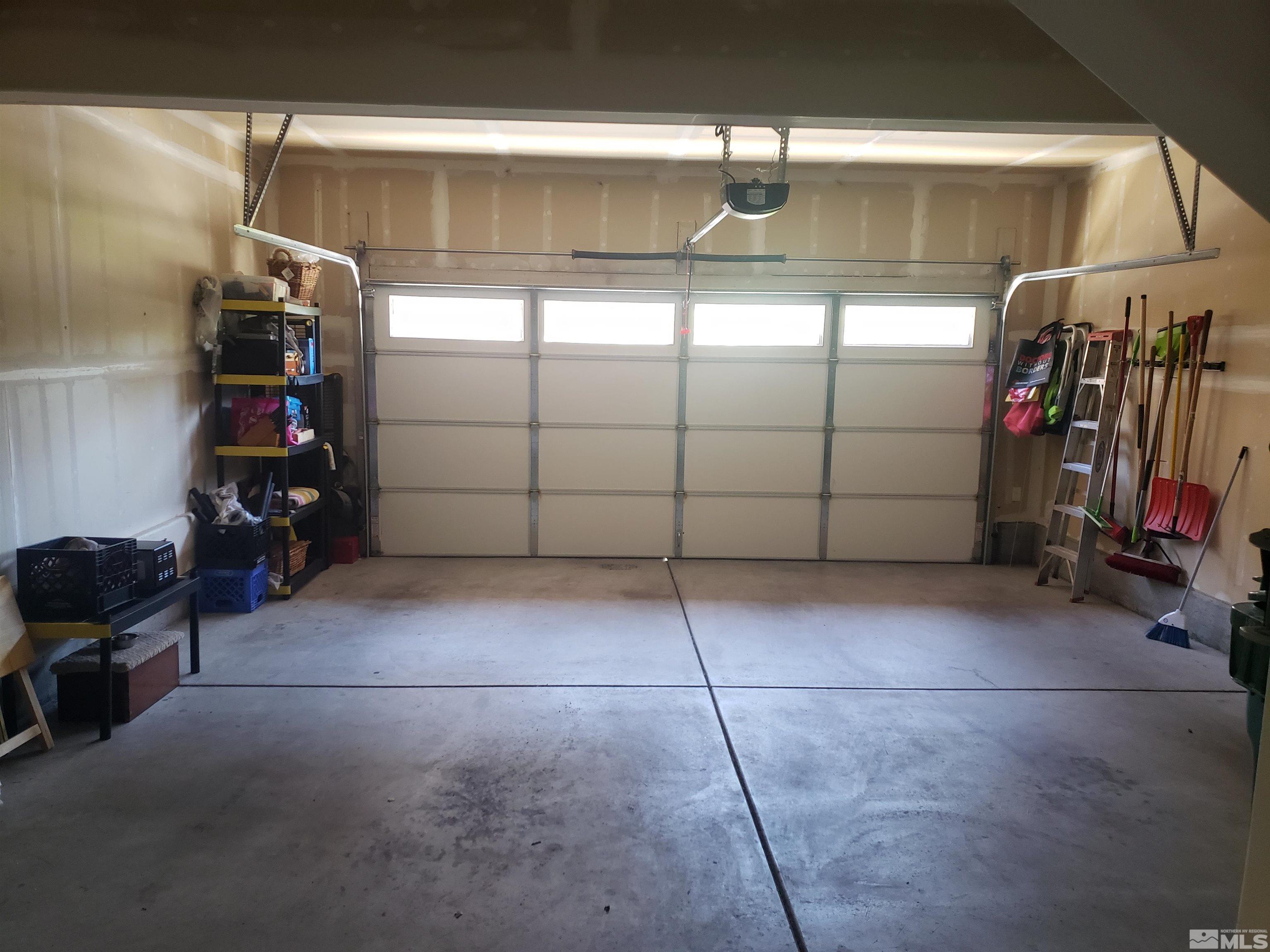 1896 Wind Ranch Road, Unit A Reno, NV 89521 - Photo 36 of 36 a view of a garage with rack and bicycle