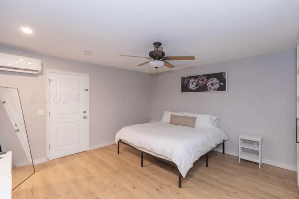 a bedroom with a bed and a table