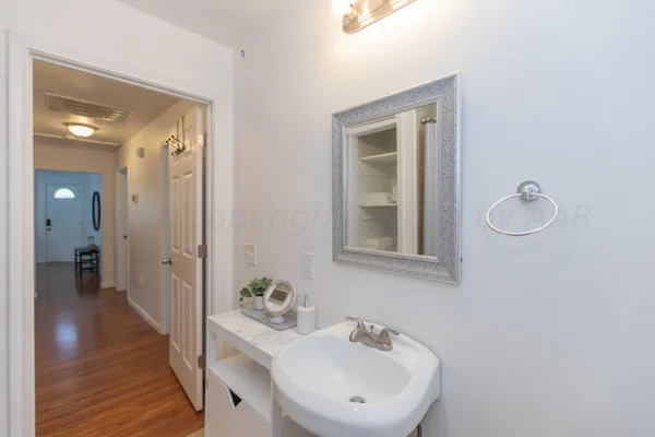 a bathroom with a sink and a mirror