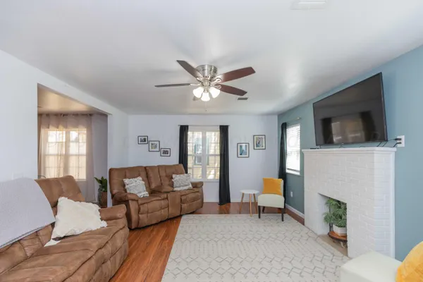 a living room with furniture and a fireplace