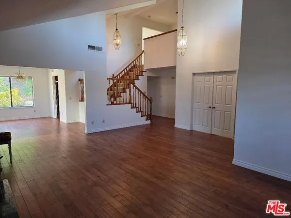 a view of entryway with wooden floor
