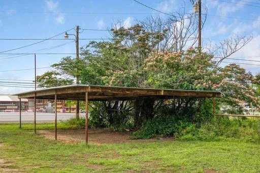 a view of a house with a backyard