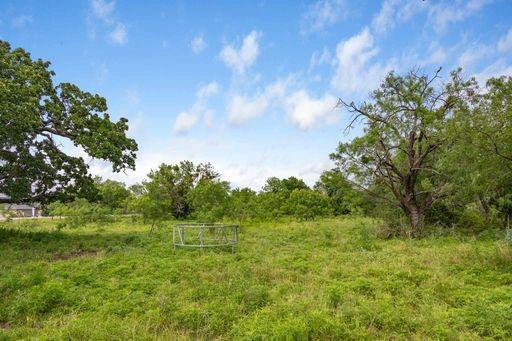 1101 Early Boulevard Early, TX 76802 - Photo 15 of 34 a view of a green field with wooden fence